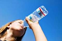 Drink eight ounces of water every hour during your flight.